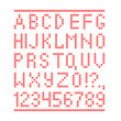 Embroided by cross stitch english alphabet with numbers and symbols isolated on white background.