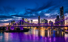 Vibrant Night Time Panorama Of Brisbane City With Purple Lights