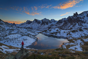 Fototapete - Woman enjoying the sunset  the mountians during a clear, autumn afternoon in the Claree valley, France.