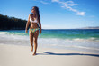 © asierromero - young woman walking in the beach