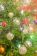 © photomario1 - Decorated and illuminated Christmas tree on indistinct, blurred and  fairytale background.