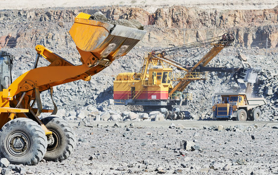 wheel loader excavator at granite or iron ore opencast mine