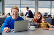 © Yakobchuk Olena - Smiling family with child at airport