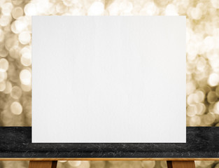Leinwandbilder - Blank white paper poster on black marble table top and sparkling