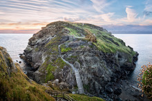 Tintagel, United Kingdom - August 12, 2016: View Of Tintagel Island And Legendary Tintagel Castle Ruins At Sunset