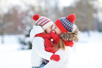 Canvas Print - happy family mother and child daughter having fun, playing at wi