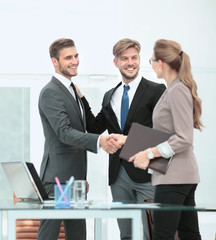 Wall Mural - Business people shaking hands, finishing up a meeting