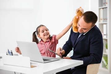 Wall Mural - Daughter playing with father in office