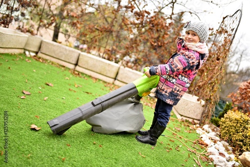 Girl With Leaf Blower Foto De Stock Adobe Stock girl-with-leaf-blower-foto-de-stock-adobe-stock