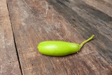 green eggplant fresh vegetable on a wooden table