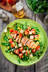 Wall Mural - Fresh salad with chicken breast, arugula and tomato