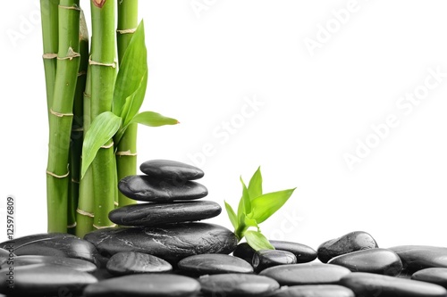 Fototapeta do kuchni stones and bamboo on the white background