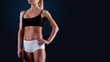 © alexeykuzhak - Close up portrait of fitness athletic young woman bodybuilder