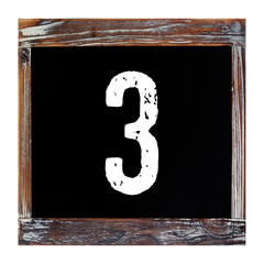 Number 3, three, on vintage wooden chalkboard isolated on white