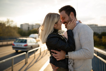 Wall Mural - Romantic couple in love enjoying sunset