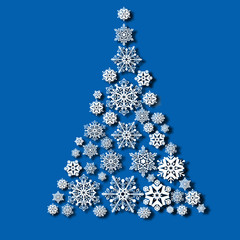 Wall Mural - Christmas tree from snowflakes, casts a shadow on blue