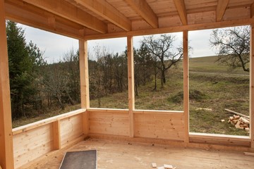 Empty building site ecological house.  External work on the building envelope. The wooden structure of the house. 
