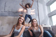 © Viacheslav Yakobchuk - Delighted girl jumping and having fun with friends
