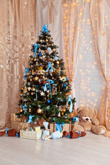 Wall Mural - Merry christmas and new year background. Classic green tree decorated in christmas toys.