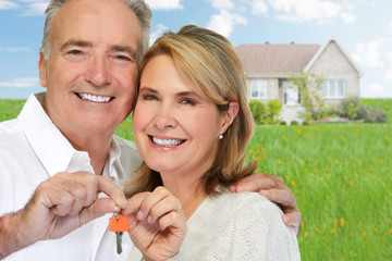 Canvas Print - Senior couple with house key.