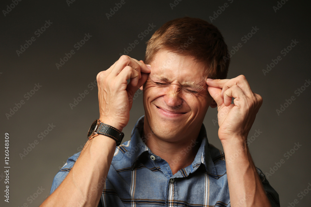 Portrait of stylish man on dark background