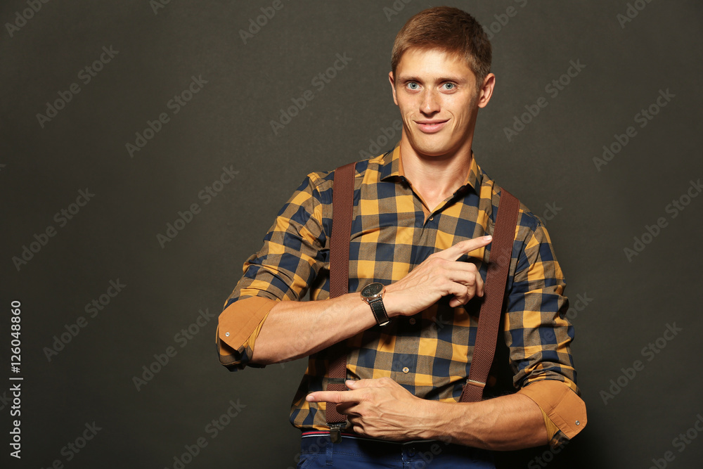 Stylish man on dark background