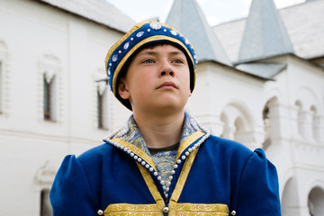 Portrait boy in national russian suit  in Kremlin Rostov Great