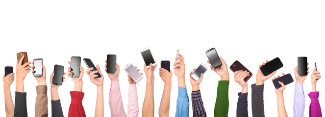 Many hands holding mobile phones isolated on white background