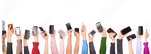 Fotografía Many hands holding mobile phones isolated on white background