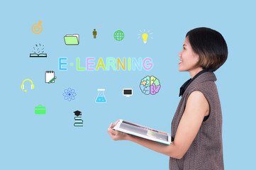 Wall Mural - E-learning concept with young women hand holding a book.