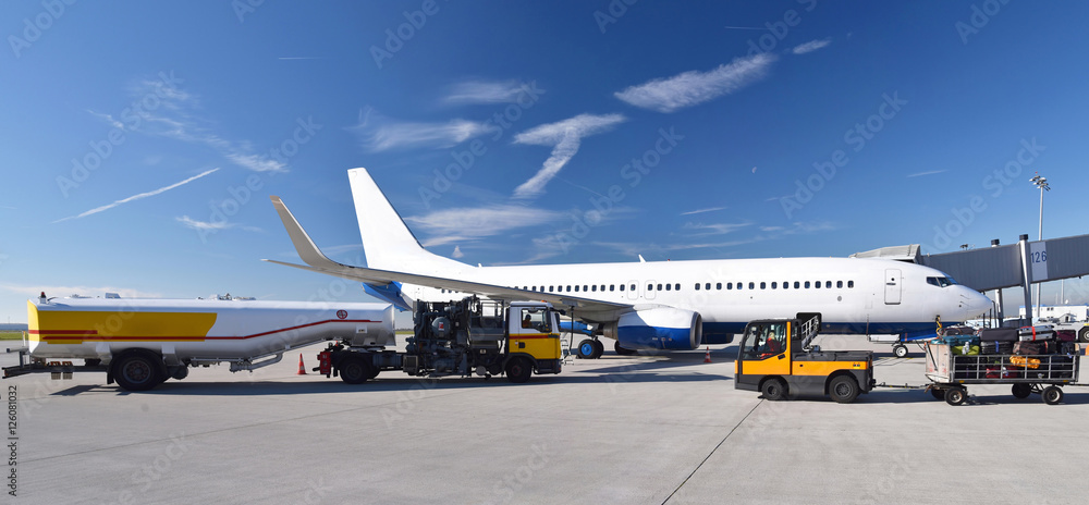 Refueling an airplane at the airport with a tanker truck // Betanken ...
