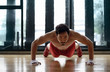 Muscular asian man doing push ups
