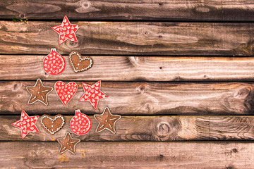 Wall Mural - Christmas tree made of wooden rustic ornaments on wooden planks background