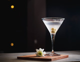 Martini cocktail drink on black background.