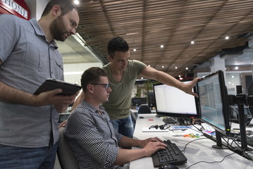 startup business people group working as team to find solution