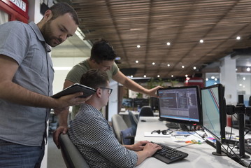 startup business people group working as team to find solution