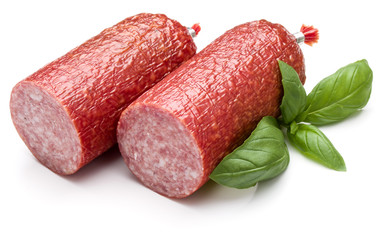 Wall Mural - Salami smoked sausage and basil leaves isolated on white backgro