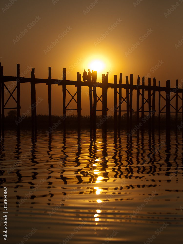 U Bein Bridge at sunset with people crossing Ayeyarwady River, M Stock ...