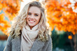 © snedorez - Beautiful smiling blond woman with curly hair and blue eyes