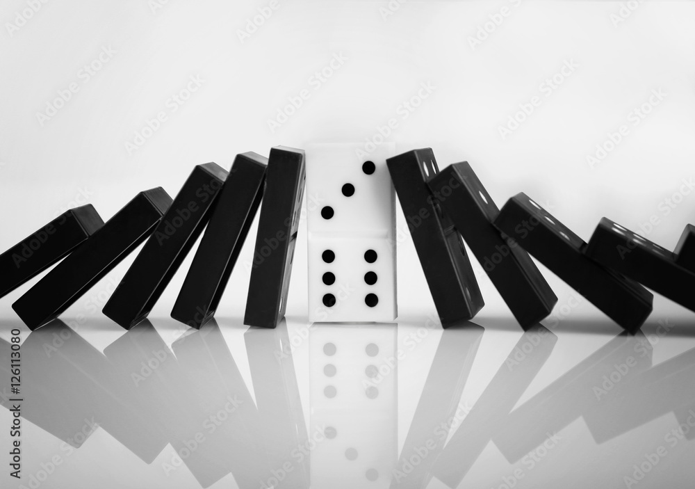 Dominoes on light background