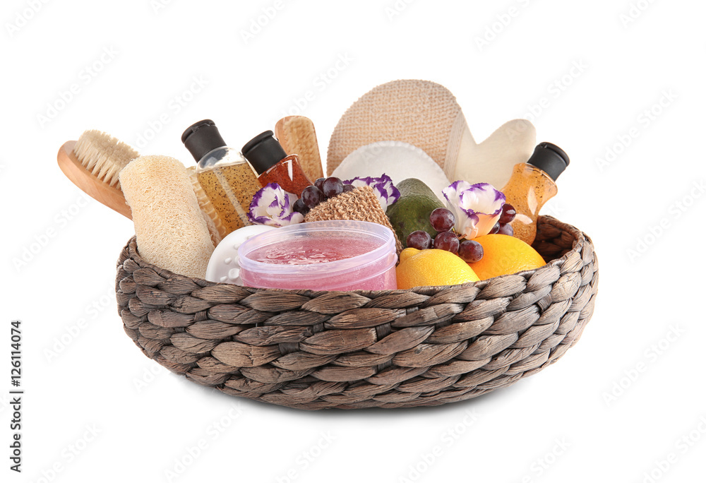 Body care set with citrus in wicker basket on white background