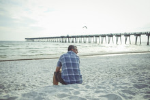 Man Sitting At Panama City Beach, Florida, USA
