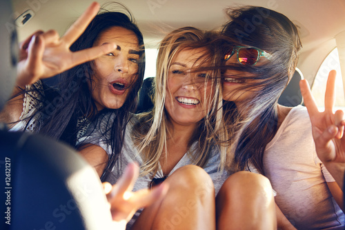 Fotografie, Tablou Three beautiful female friends make peace signs
