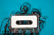 tangled cassette tape on turquoise painted wood