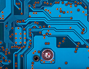 Wall Mural - blue circuit board background of computer motherboard