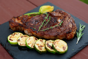 Rib eye steak on slate plate