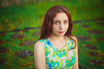 beautiful woman standing and smiling in abeautiful natural backg