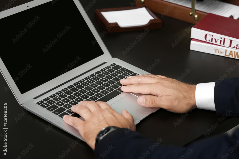 Man working with laptop in modern office