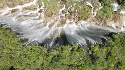 Wall Mural - overhead aerial view of a beautiful waterfall in jiuzhaigou national park in china