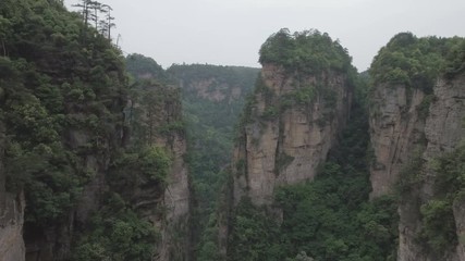Wall Mural - flying through 'vertical mountains' in the iconic zhangjiajie national park in china